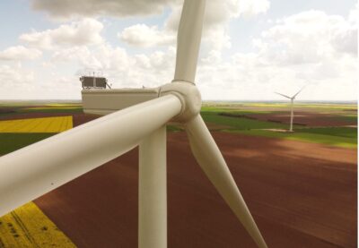 Wind turbine in field.