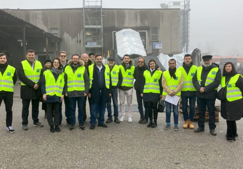 The REFRESH team in hi-vis jackets standing in front of Gees Recycling plant.