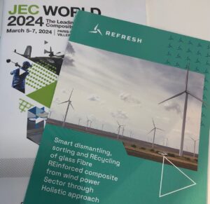 A REFRESH leaflet on top of the JEC World visitor guide.