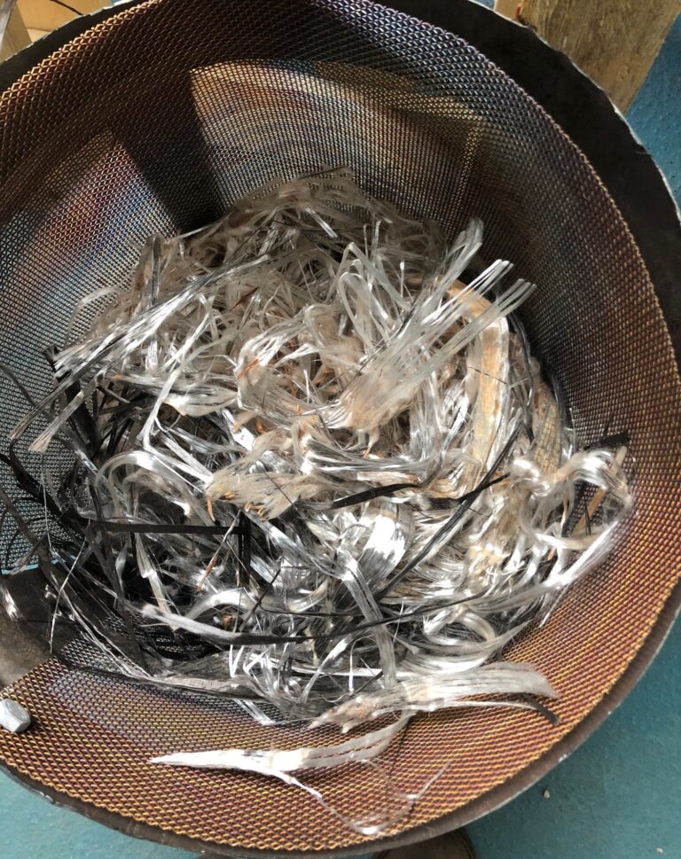 Fibres in metal bucket.