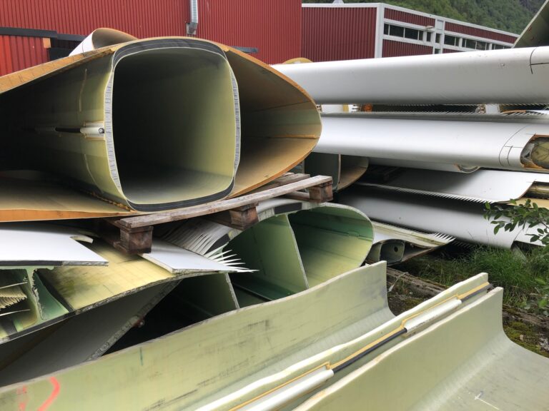 Parts of wind turbine blades piled up.
