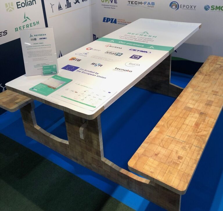 A picnic table with a white top.
