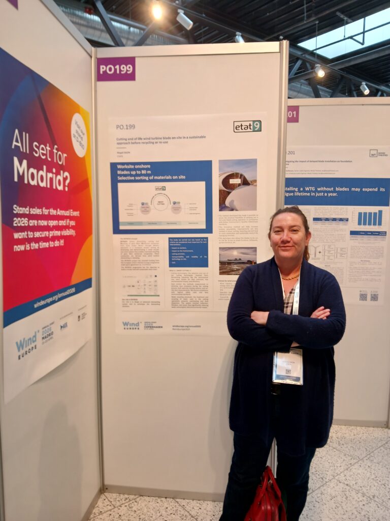 A person standing in front of a poster.