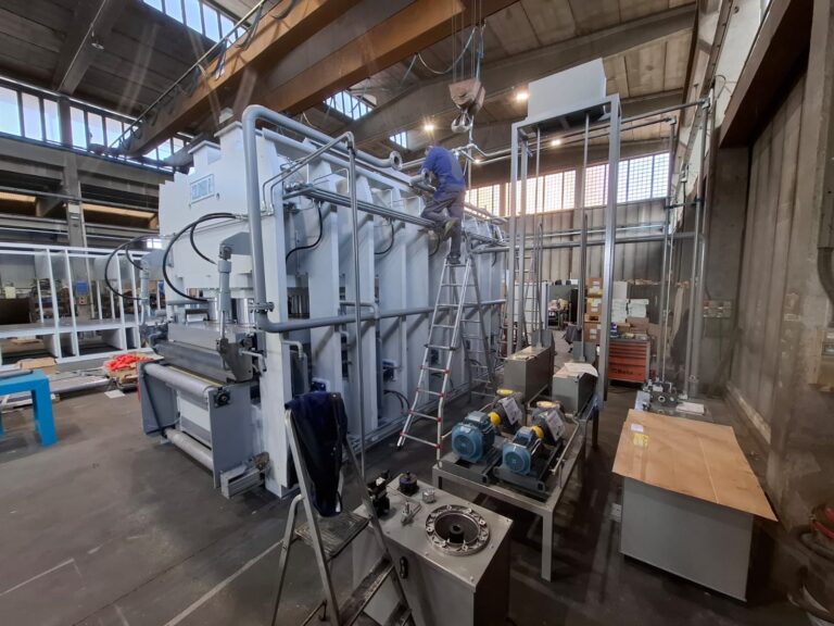 A large grey machine in a factory.