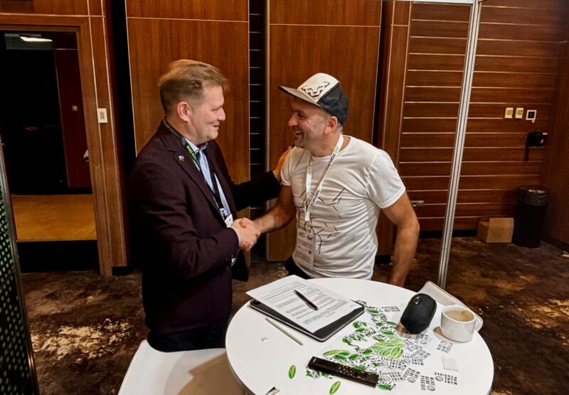 Two men shaking hands.